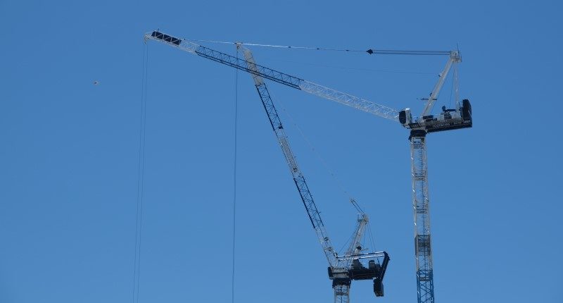 cranes construction with blue sky background