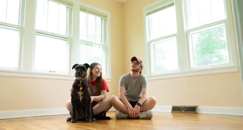 couple in new home with dog