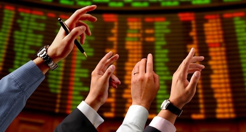 stock market bidding hands raised