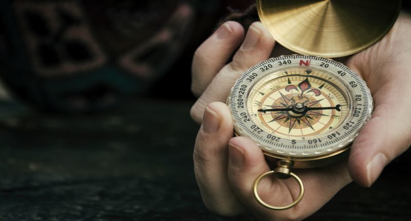 Person holding compass - resized