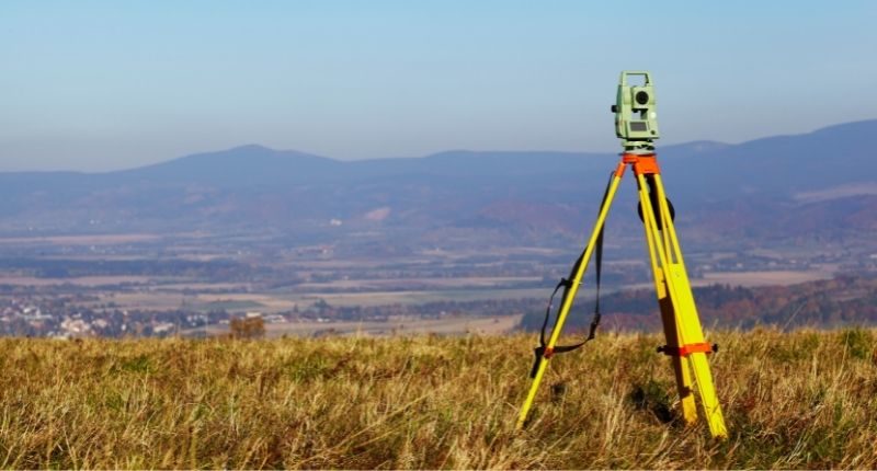 surveying-device-yellow-land-feature